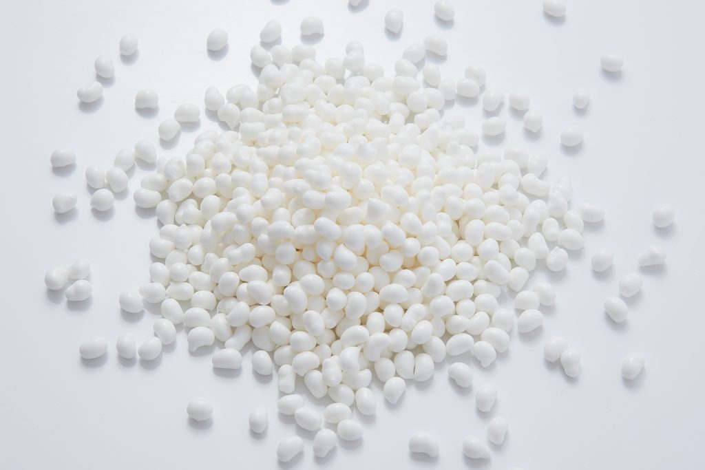 White hot melt adhesive particles