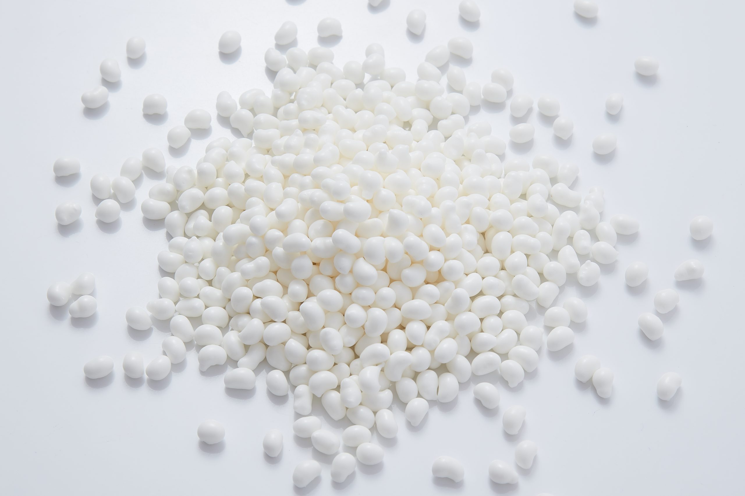 White hot melt adhesive particles